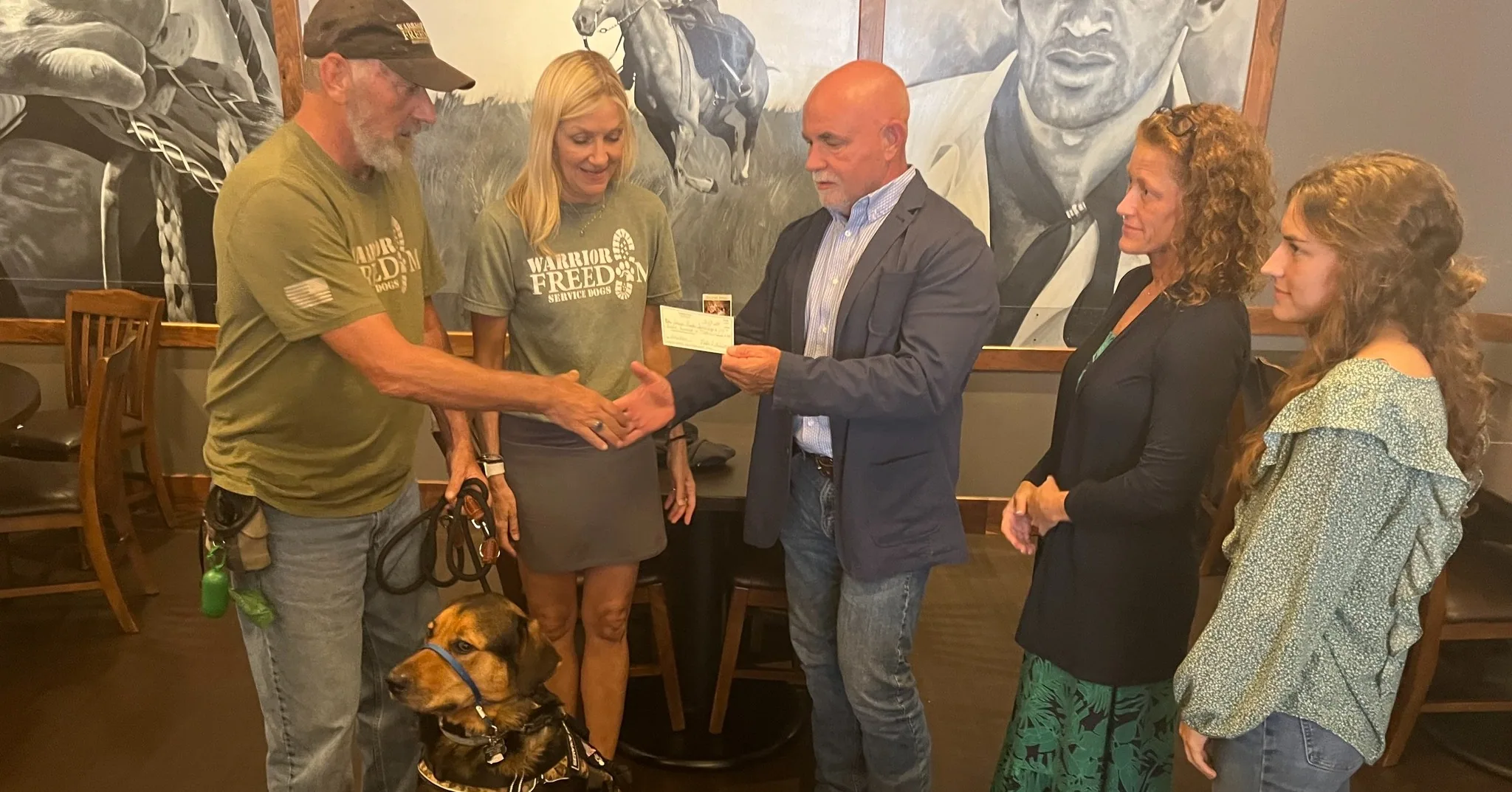 Goodpaster presenting a donation check to Warrior Freedom